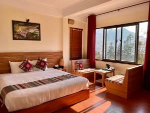 Postel nebo postele na pokoji v ubytování Sapa Garden Hotel
