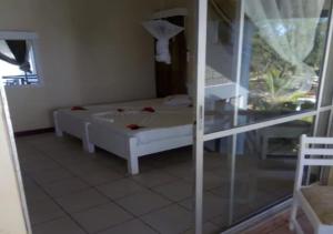 Vuode tai vuoteita majoituspaikassa Watamu Adventist Beach Resort