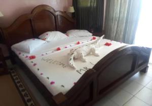 Vuode tai vuoteita majoituspaikassa Watamu Adventist Beach Resort
