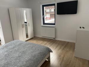 Telewizja i/lub zestaw kina domowego w obiekcie Center House