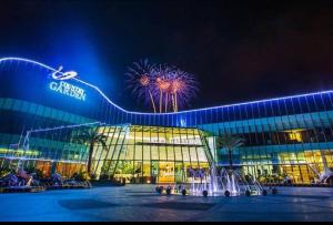 a large building with fireworks in front of it at JB Country Garden J Agape Homestay 2106-6A in Johor Bahru