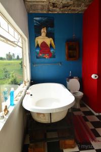 a bathroom with a large white tub in a room at Eureka! in Winterton