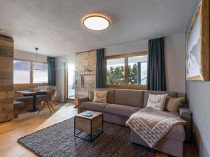 a living room with a couch and a table at Van's Place, Luxury Apartment in Kaltenbach +46 photos