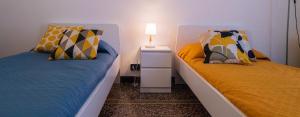 A bed or beds in a room at La casa di Archimede