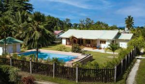 an aerial view of a house with a swimming pool at JMS Ventures in La Digue