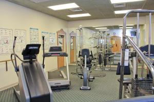a gym with several treadmills and exercise bikes at Bavarian Inn Lodge in Frankenmuth
