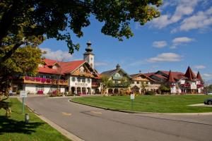 a street in a town with a clock tower at Bavarian Inn Lodge in Frankenmuth