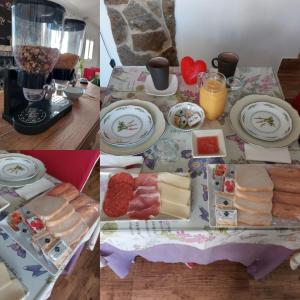 una mesa con queso y otros alimentos en ella en Pensión Isla - Couples Only en Casas de Cuadra