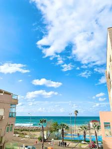 a view of the beach and the ocean at Beach Apartments in Haifa +71 photos