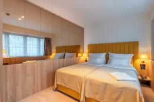 Postel nebo postele na pokoji v ubytování HOTEL AGAPE