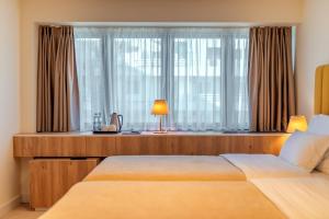 Postel nebo postele na pokoji v ubytování HOTEL AGAPE