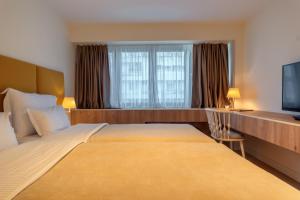 Postel nebo postele na pokoji v ubytování HOTEL AGAPE