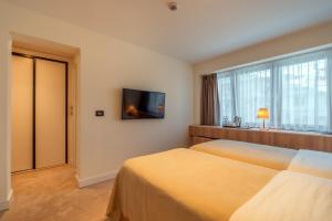 Postel nebo postele na pokoji v ubytování HOTEL AGAPE