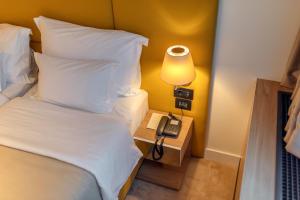 Postel nebo postele na pokoji v ubytování HOTEL AGAPE