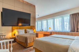 Postel nebo postele na pokoji v ubytování HOTEL AGAPE