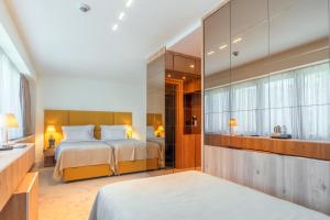 Postel nebo postele na pokoji v ubytování HOTEL AGAPE