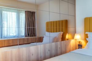 Postel nebo postele na pokoji v ubytování HOTEL AGAPE
