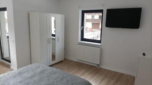 Telewizja i/lub zestaw kina domowego w obiekcie Center House