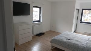 Łóżko lub łóżka w pokoju w obiekcie Center House