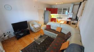 TV a/nebo společenská místnost v ubytování Villa Wind Apartments
