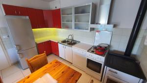 Kuchyň nebo kuchyňský kout v ubytování Villa Wind Apartments