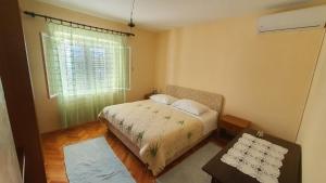 Postel nebo postele na pokoji v ubytování Villa Wind Apartments
