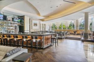 a bar in a restaurant with chairs and tables at Studio at Sorrento Residences- FontaineBleau Miami Beach home in Miami Beach
