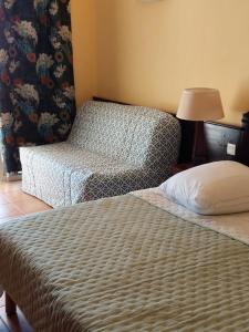 a hotel room with two beds and a lamp at STUDIO 1015 in Sainte-Anne
