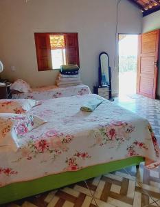 Postel nebo postele na pokoji v ubytování Chalé Anjo Gabriel II em São Tomé das Letras