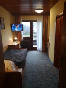 TV a/nebo společenská místnost v ubytování Hotel Wirt Z'Minsta