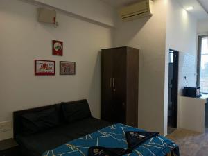 Postel nebo postele na pokoji v ubytování Marigold Stay