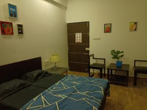 Postel nebo postele na pokoji v ubytování Marigold Stay