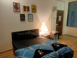 Postel nebo postele na pokoji v ubytování Marigold Stay