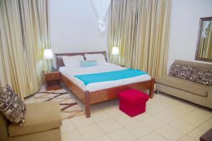 Postel nebo postele na pokoji v ubytování One Click Hotel