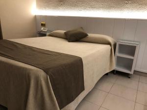 Postel nebo postele na pokoji v ubytování Hotel Claramar
