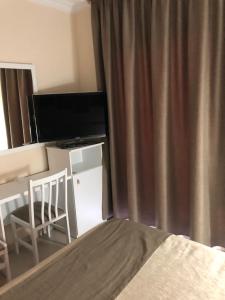 TV a/nebo společenská místnost v ubytování Hotel Claramar