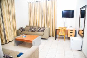 TV a/nebo společenská místnost v ubytování One Click Hotel