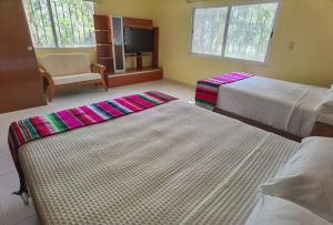 Кровать или кровати в номере Paradise Ranch