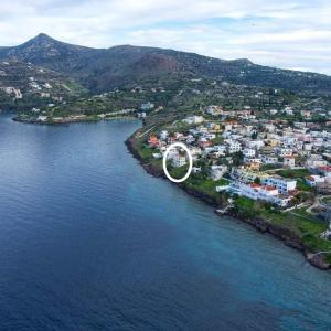 a large white object on an island in the water at Ithaca in Perdika