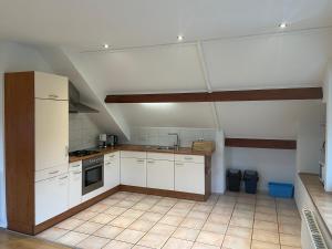 Η κουζίνα ή μικρή κουζίνα στο Vakantiewoning Op De Bos +7 φωτογραφίες