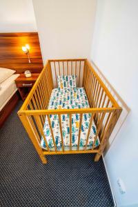 Posteľ alebo postele v izbe v ubytovaní WELLNESS HOTEL FRYMBURK APARTMAN 502C