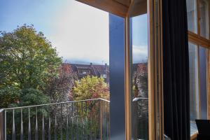 a view from a window of a balcony at ElzLand Hotel 9 Linden "Ferienwohnung" in Elzach