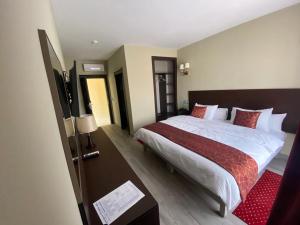 Postel nebo postele na pokoji v ubytování Hôtel Saja