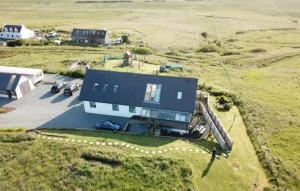 an aerial view of a house in a field at Clouds B&B in Kilmuir