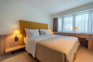 Postel nebo postele na pokoji v ubytování HOTEL AGAPE
