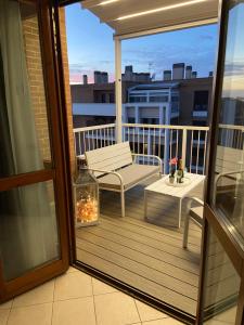 A balcony or terrace at AGM Suite Rome Airport FCO - Attico Parco Leonardo