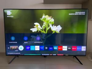 A television and/or entertainment centre at AGM Suite Rome Airport FCO - Attico Parco Leonardo