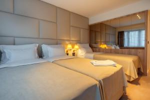 Postel nebo postele na pokoji v ubytování HOTEL AGAPE