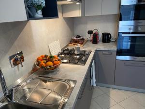 A kitchen or kitchenette at AGM Suite Rome Airport FCO - Attico Parco Leonardo
