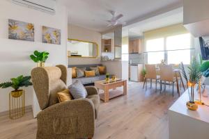 a living room with a couch and a table at SWEET DREAMS APARTMENT NEAR PUERTA DEL SOL in Madrid